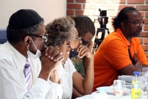 A group of people sitting at a table.