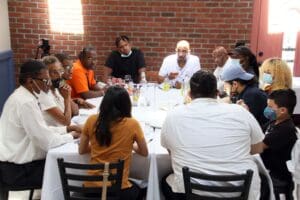 A group of people sitting around a table.