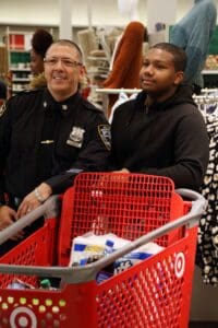 Two people in a store with shopping carts