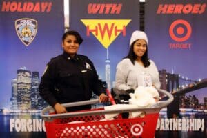 Two women in police uniforms and a shopping cart