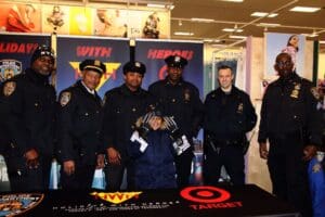 A group of police officers standing around a table.