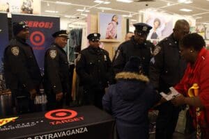 A group of police officers standing around a store.