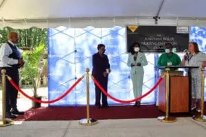 A red carpet with three people standing on it