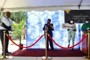 A man standing in front of a red carpet.