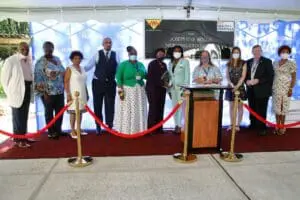 A group of people standing in front of a podium.