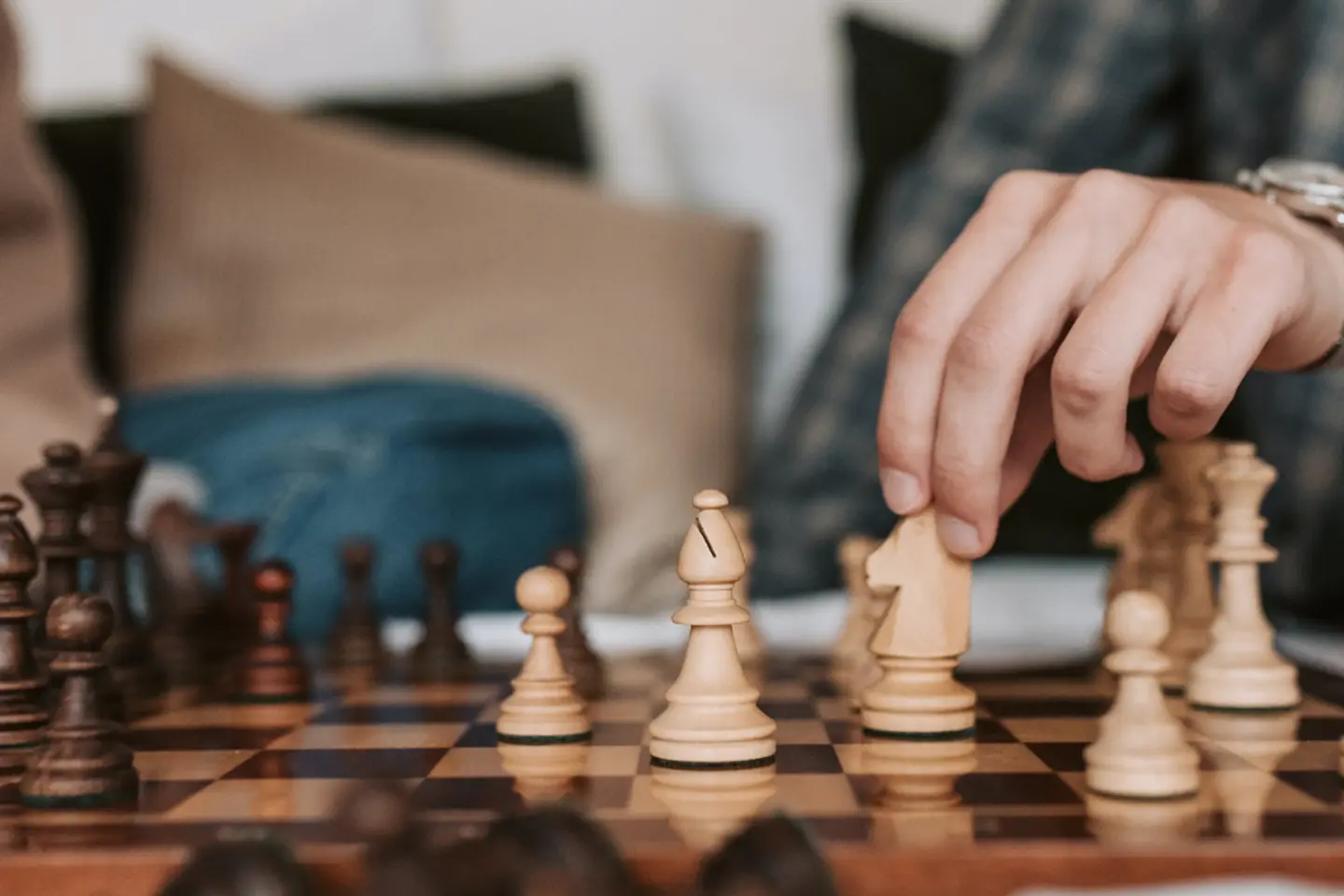 A person playing chess on the table